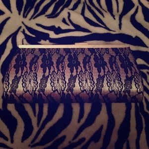 Small hand clutch; sliver and black