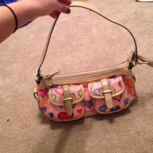Pale pink purse with red, blue, and yellow hearts