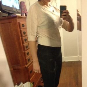 Tan colored , see thru shirt .