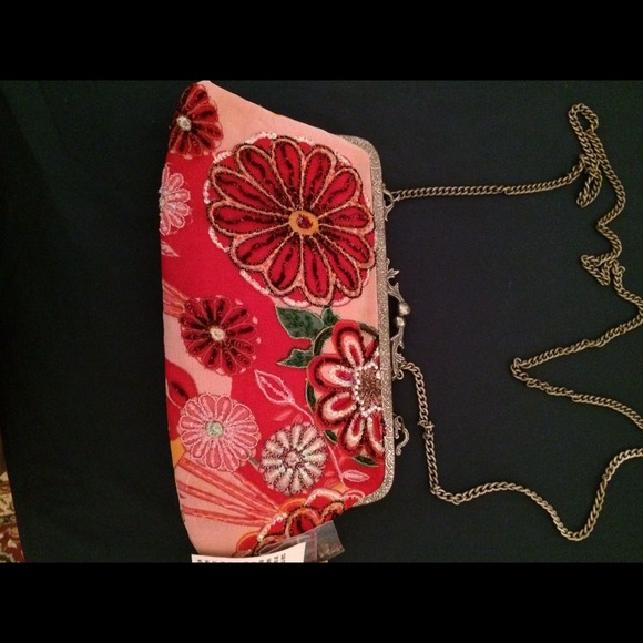 Bright beautiful Clutch purse with shoulder chain.