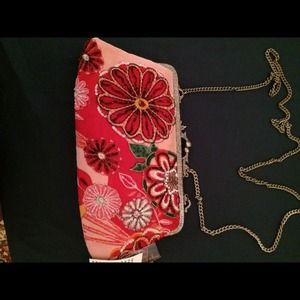 Bright beautiful Clutch purse with shoulder chain.
