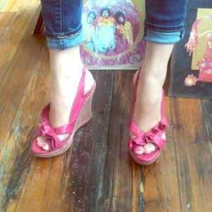 Cute, comfortable, and frilly pink wedges