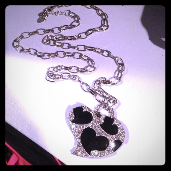 24 inch necklace with silver black heart charm.