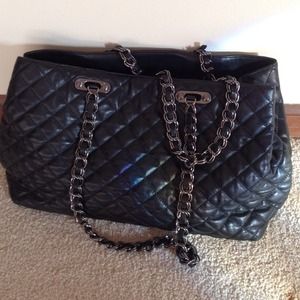 Black quilted handbag.