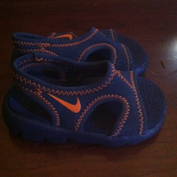 Blue and orange Nike sandals