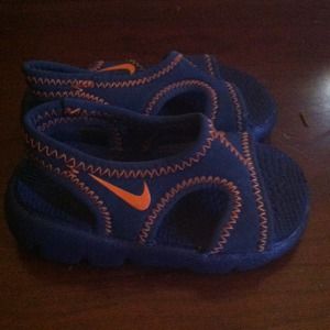 Blue and orange Nike sandals