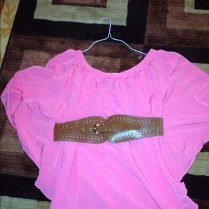 Pink blouse with brown belt.