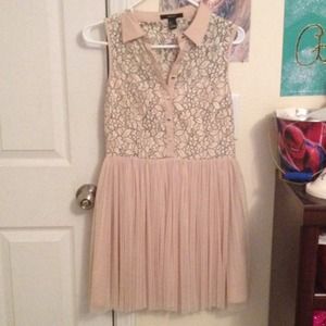 Beige dress with black flower lace design