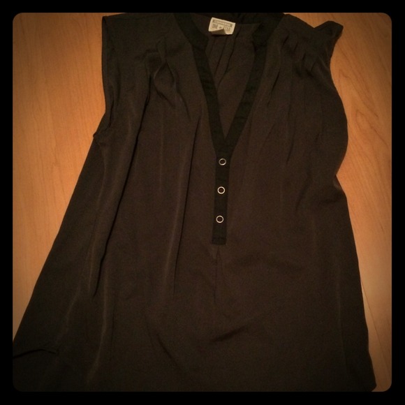Grey sleeveless blouse with black trim