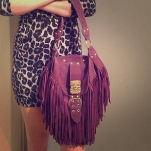 Deep purple faux suede fringe handbag.