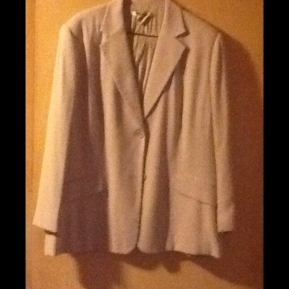 Tan suit jacket with skirt.