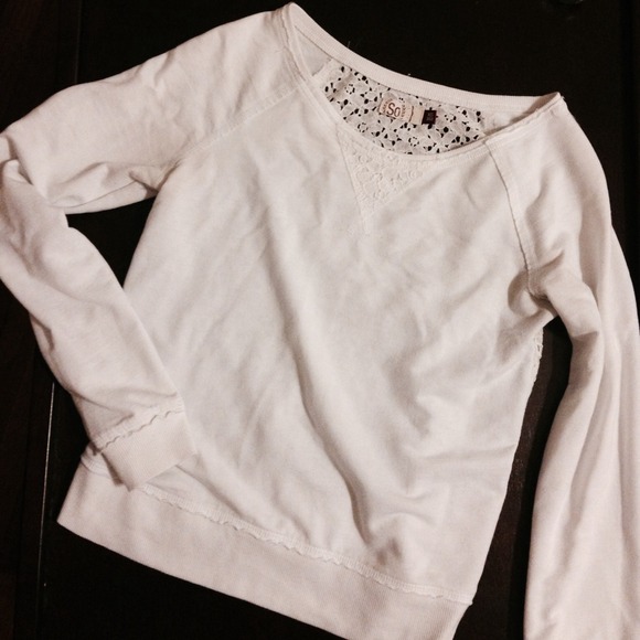 White sweater with cut-out design on back