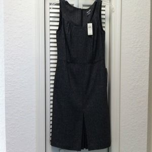 Wool twead dress hits knee.