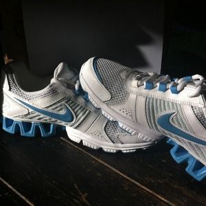 White, green, blue nike running shoes
