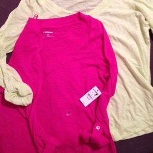 Set of two v neck roll up shirts.