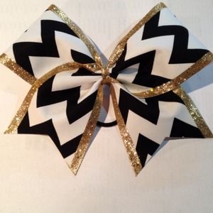 Black chevron out lined with gold hair bow.