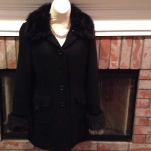 Long black coat with "fur" trim.