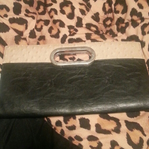 Beige and black clutch