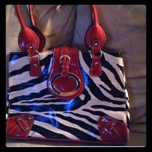 NWOT pretty zebra print with red detail purse