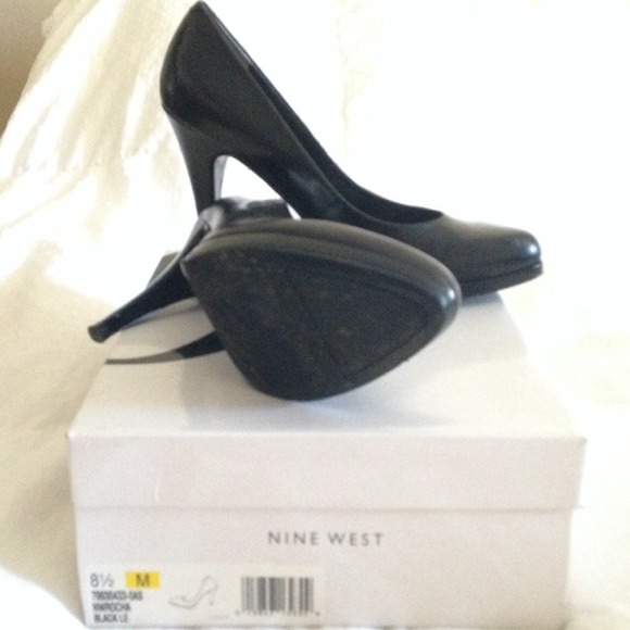 Black Leather high heel pumps.