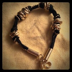Black corded bracelet with silver knots and chain