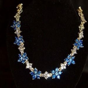 White zircon with blue sapphires