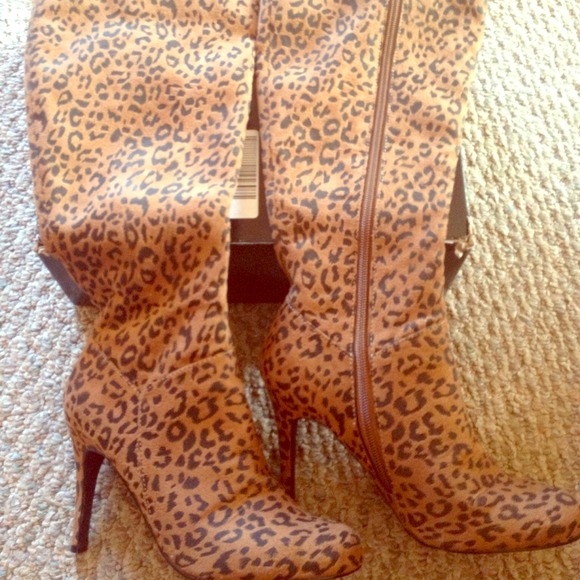Brand new, never-worn, sz7, leopard print boots.