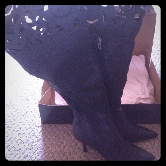 Over-the-knee, cut-out boots.