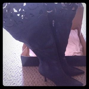 Over-the-knee, cut-out boots.