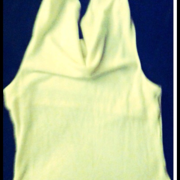 Adorable sleeveless, flowing turtle neck. Sml