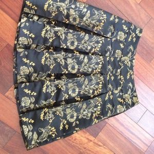 Black skirt with gold embroidery.