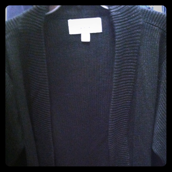 Black cardigan with gold sparkle.