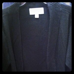 Black cardigan with gold sparkle.