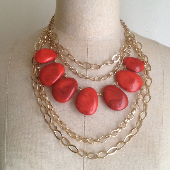 Gold chain and orange bead necklace