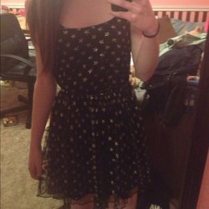 Black dress with gold stars.