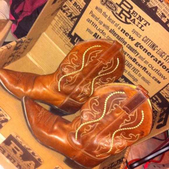 Pointed brown leather cowboy boots . Justin boots
