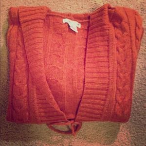 Gorgeous orangish red sweater.