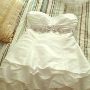 Short white reception wedding dress.