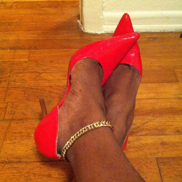 Cherry red patten leather heels.