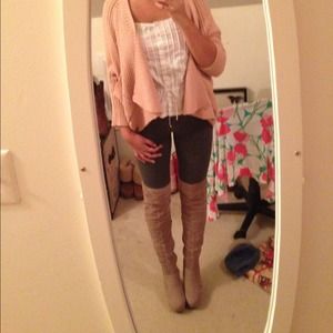 Thigh high boots. Never worn.