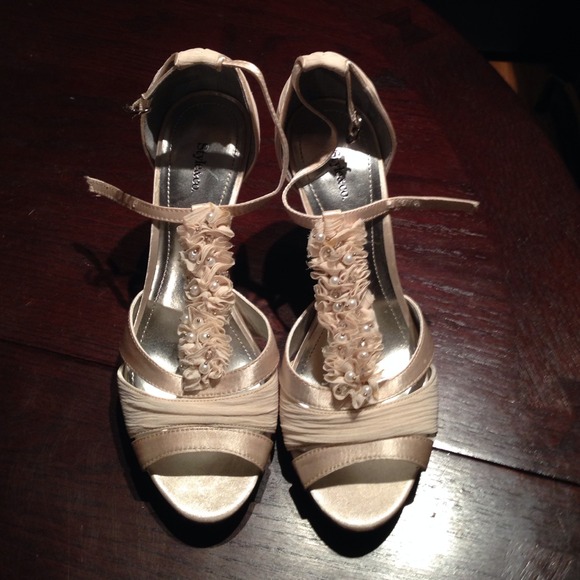 Cream/ Ivory/ Champagne heels heel is 4 1/4 inch.