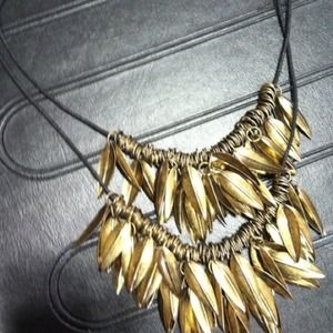 Gold colored feather necklace