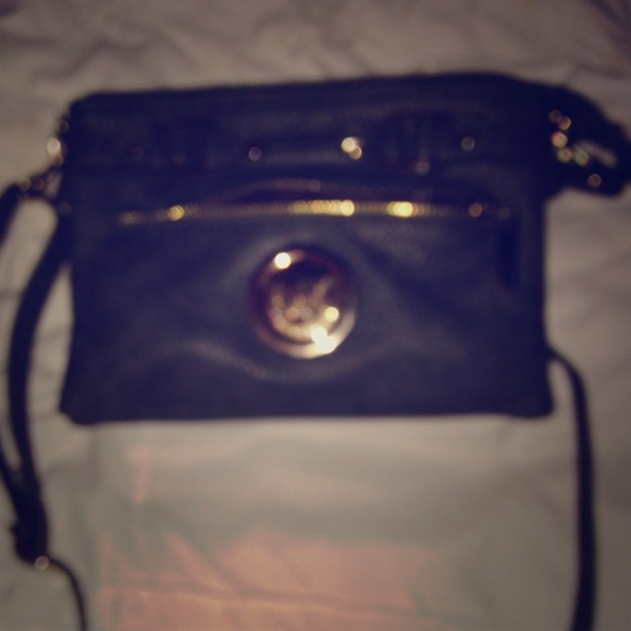 Michael Kors small gray purse.