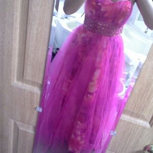A bright pink prom dress