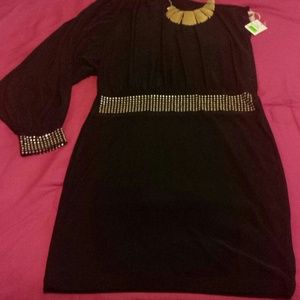 One shoulder black dress.