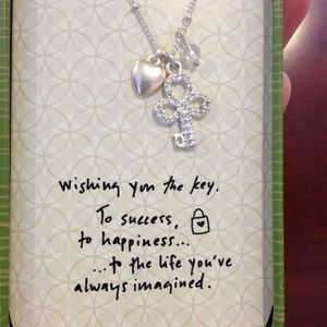 Silver necklace with key charm