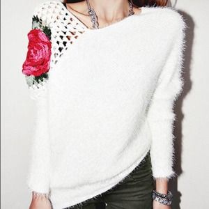 Fluffy white sweater with crochet appliqué