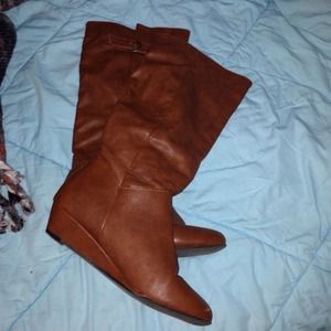Brown riding boots.