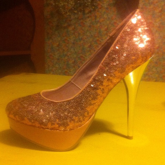 Pink sequin DEB pump heels.