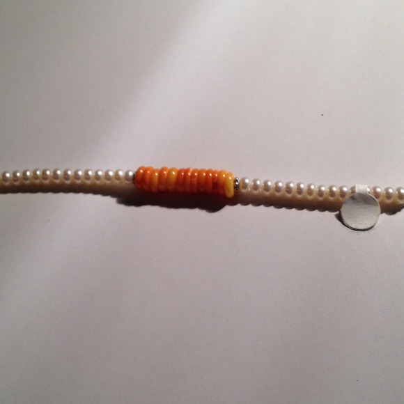 Beautiful bracelet of pearls and coral disks